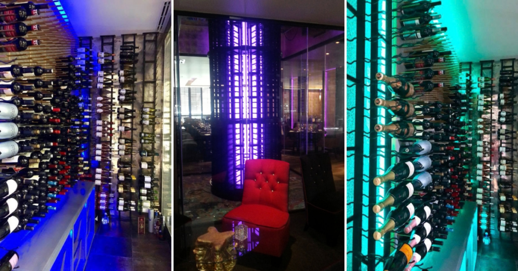 Modern wine racks with bottles and ambient lighting.